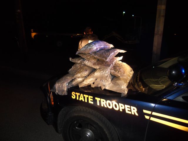 seized marijuna stacked on OSP car