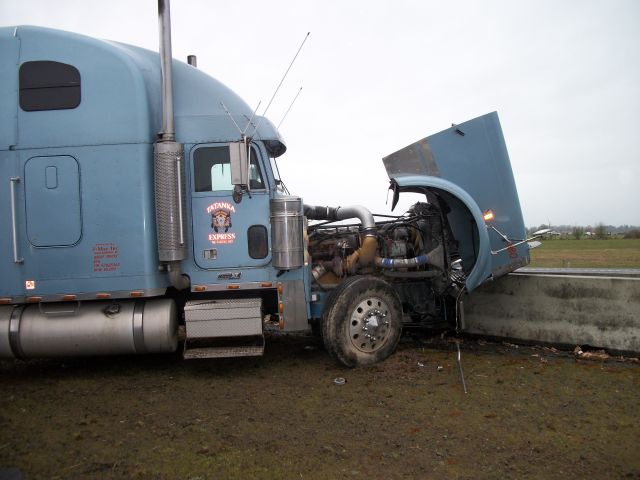 Freightliner crashed into concrete divider Freightliner crashed into concrete divider
