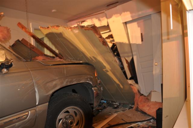 Close up front of SUV into Apartment Building Close up front of SUV into Apartment Building