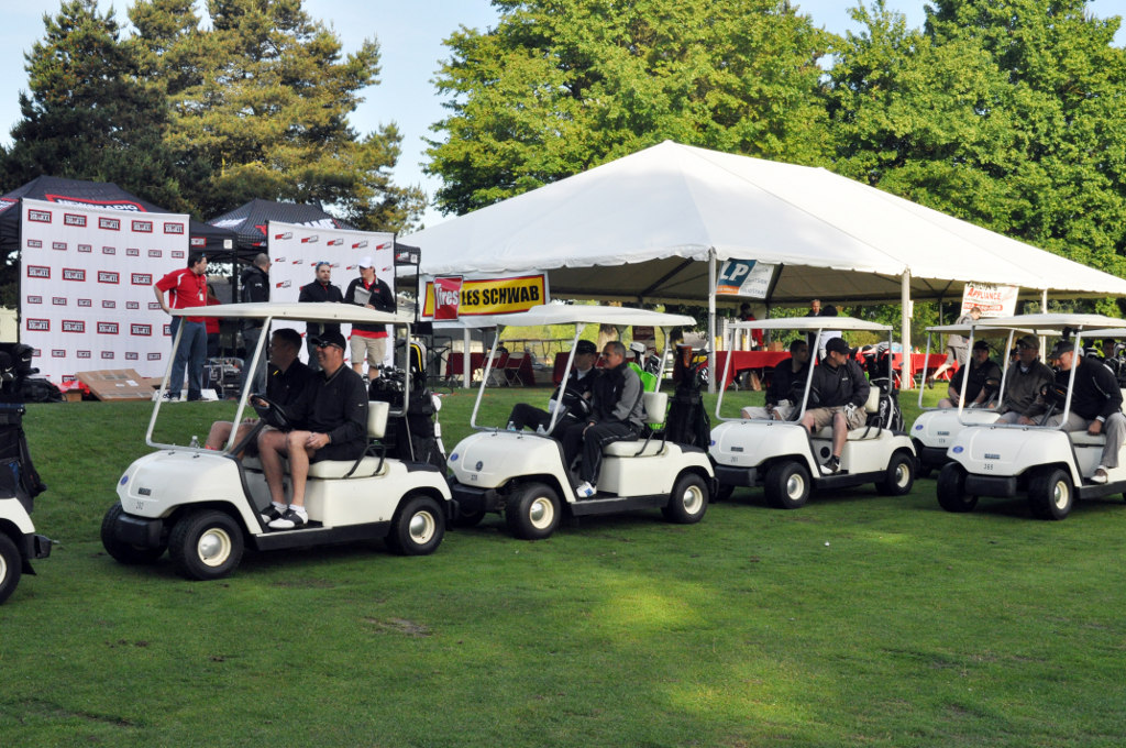 Golf teams, made up of local business leaders and Oregon National Guardsmen, line up to begin the 7th Annual Golfing for the Guard Tournament at Heron Lakes Golf Course, May 25. Golf teams, made up of local business leaders and Oregon National Guardsmen, line up to begin the 7th Annual Golfing for the Guard Tournament at Heron Lakes Golf Course, May 25.