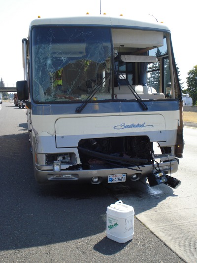Front end of motor home after rear ending semi trailer