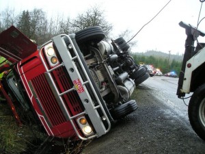 Crash scene 2005 Freightliner truck pulling two trailers loaded with hay 3