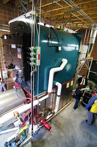 Estacada High School Biomass Boiler The woody biomass boiler at Estacada High School burns wood pellets, heats 120,000 square feet and saves the school over $11,000 per year in energy bills. Photo: Marcus Kauffman, Oregon Department of Forestry