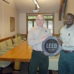 Jon Price, Contracting Officer Representative, and Terry Baker, McKenzie River District Ranger, in the general meeting room of the Ranger District